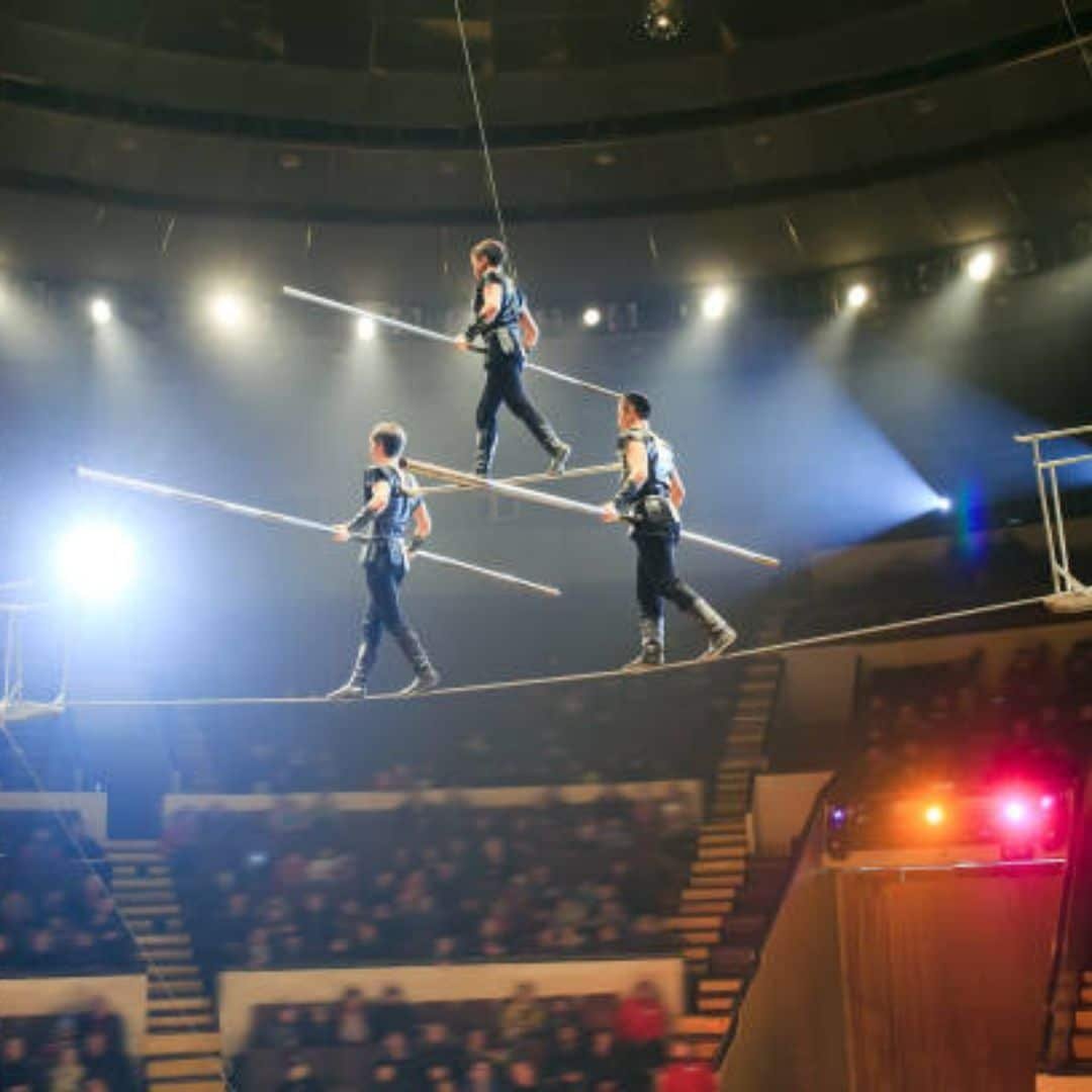 Tightrope acrobats in a circus show in Southeast Asia Tightrope acrobats in a circus show in Southeast Asia