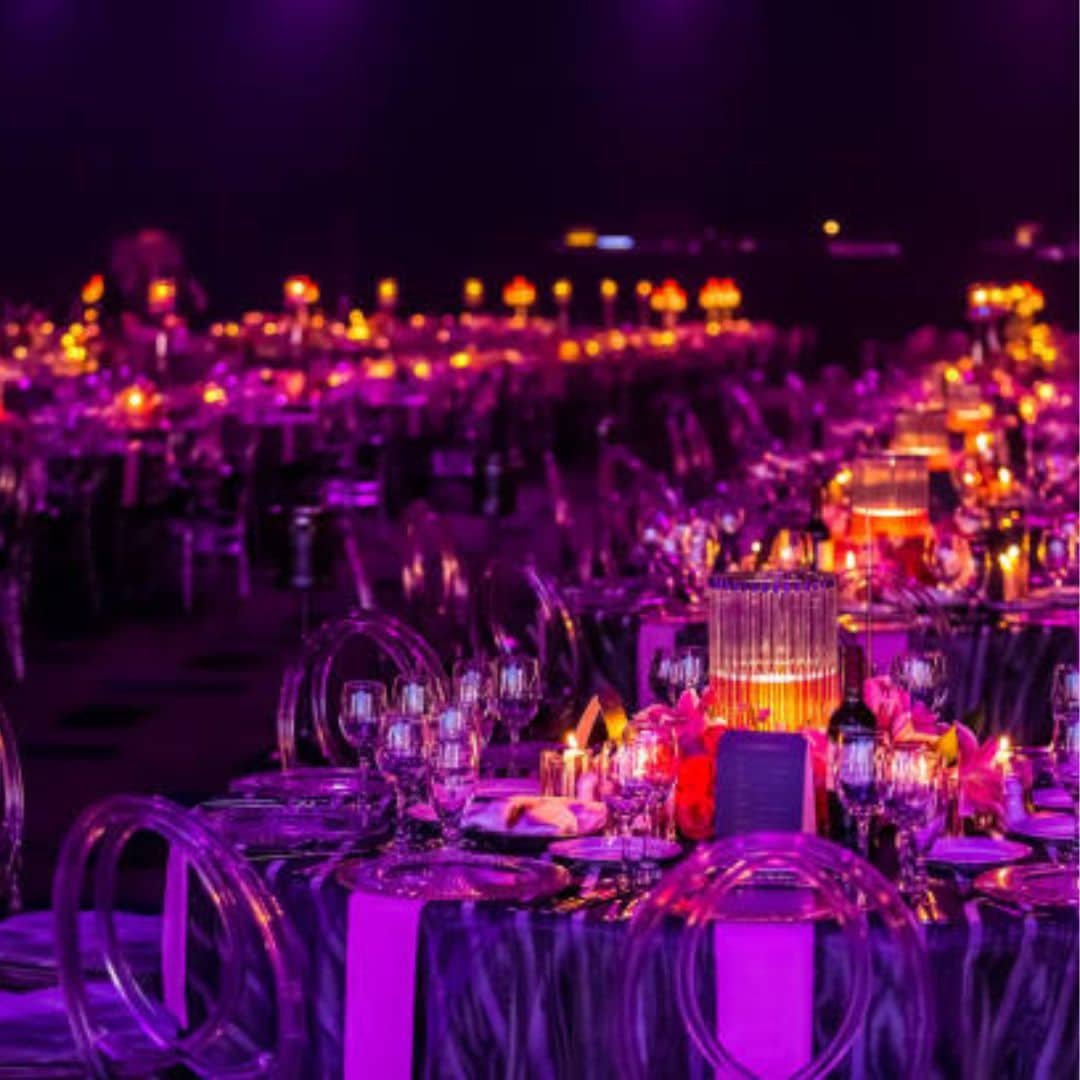 Gala dinner tables lit in purple in Southeast Asia Gala dinner tables lit in purple in Southeast Asia