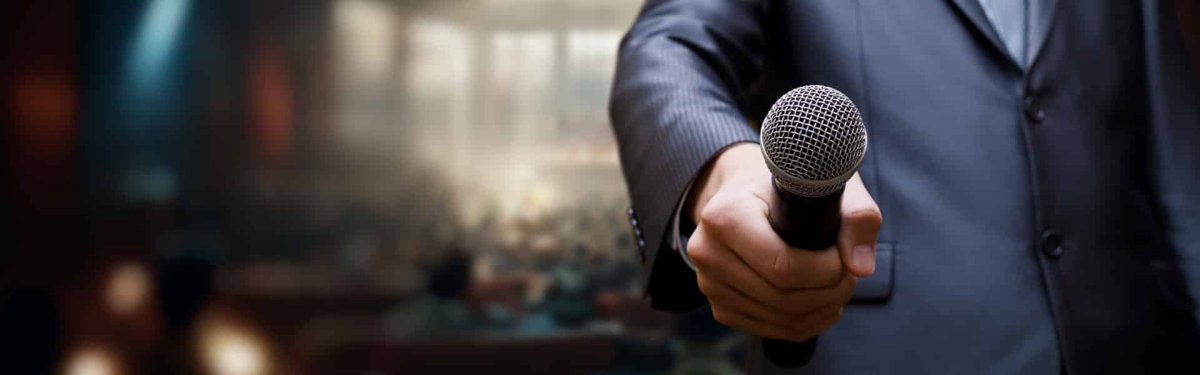 Emcee holding a microphone in Southeast Asia