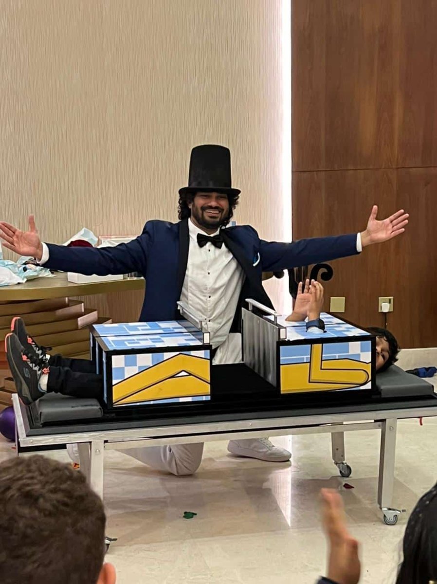 Magician performing a stage show with props in Southeast Asia