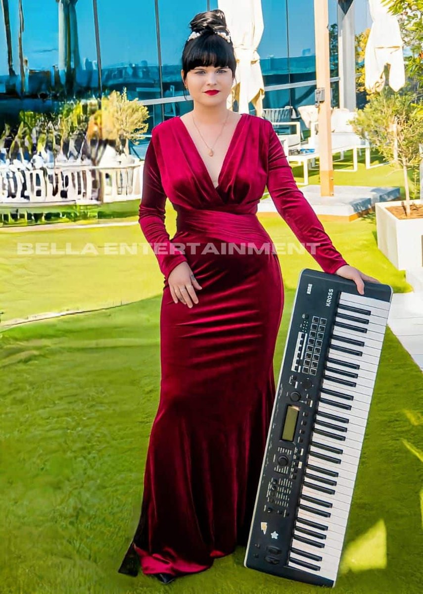 Pianist with a keyboard at an outdoor event in Southeast Asia Pianist with a keyboard at an outdoor event in Southeast Asia