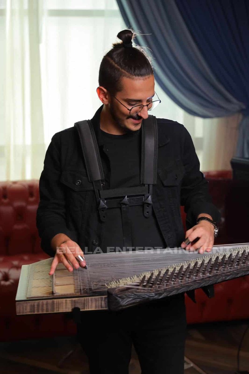 Qanun player performing in Southeast Asia