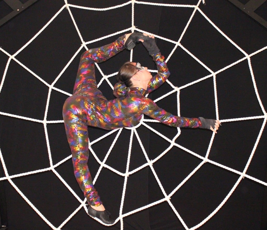 Contortionist on a spider web rig in Southeast Asia