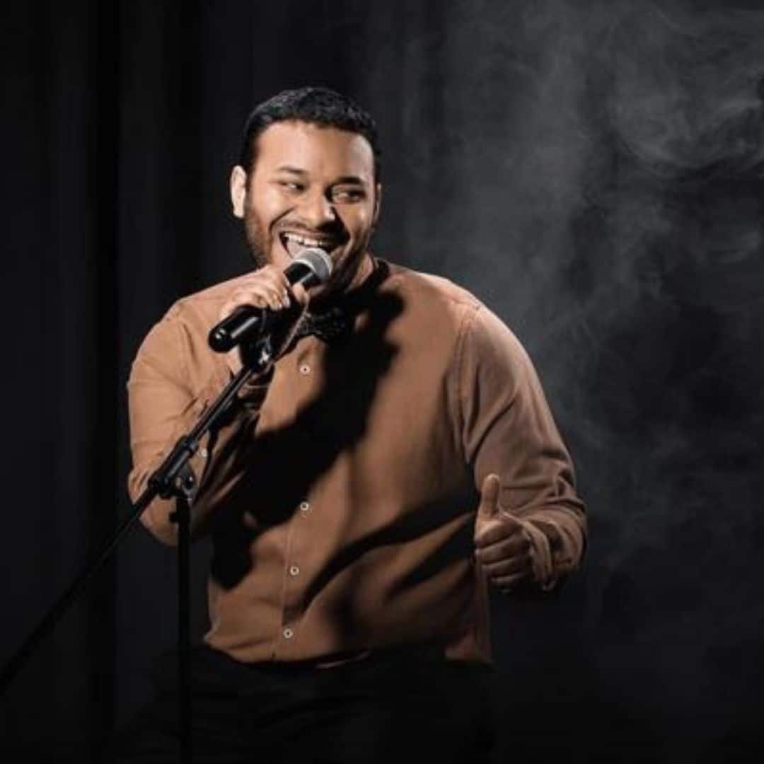 Stand-up comedian with a microphone in Southeast Asia Stand-up comedian with a microphone in Southeast Asia